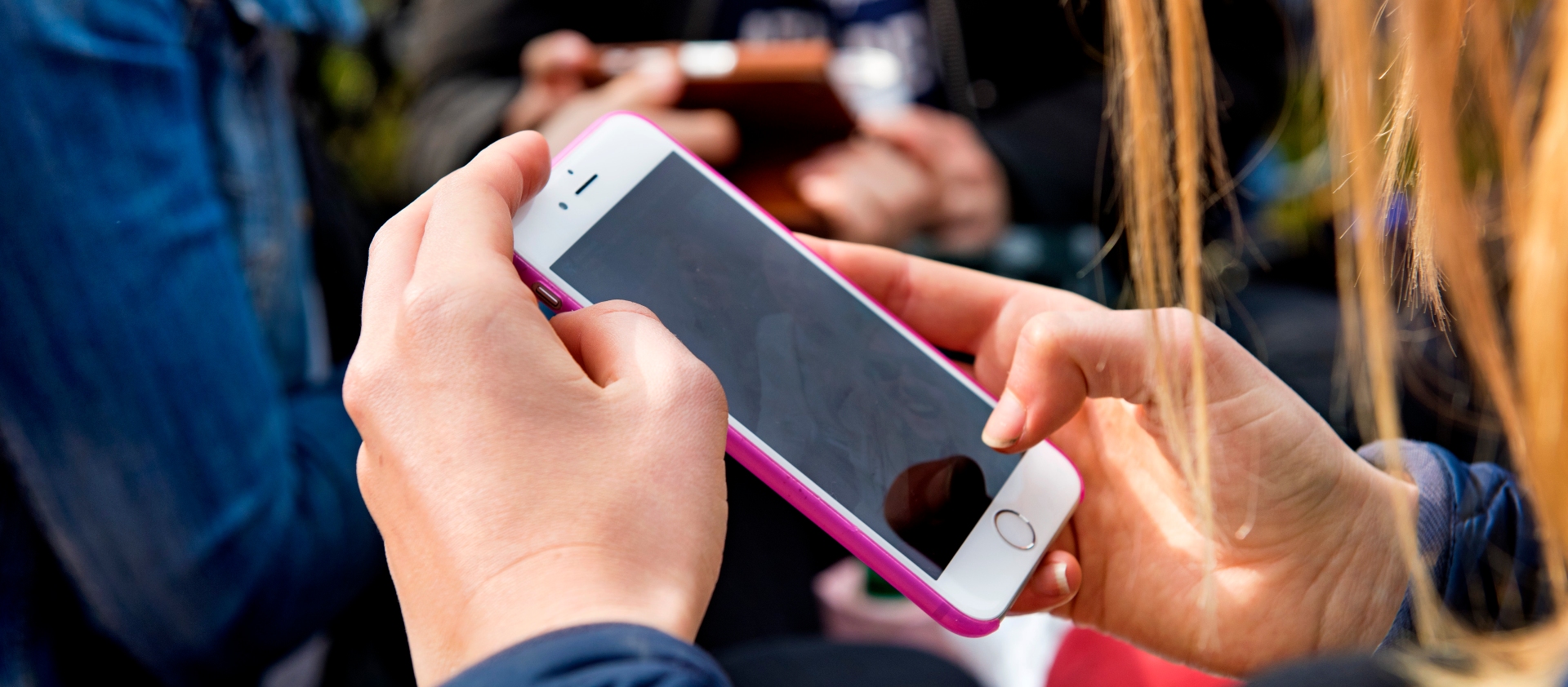 Two hands holding a mobile phone