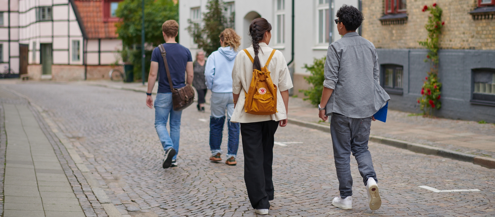 A group of students walking down the street