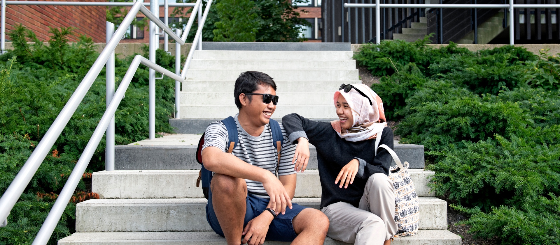 Two international students on the stairs